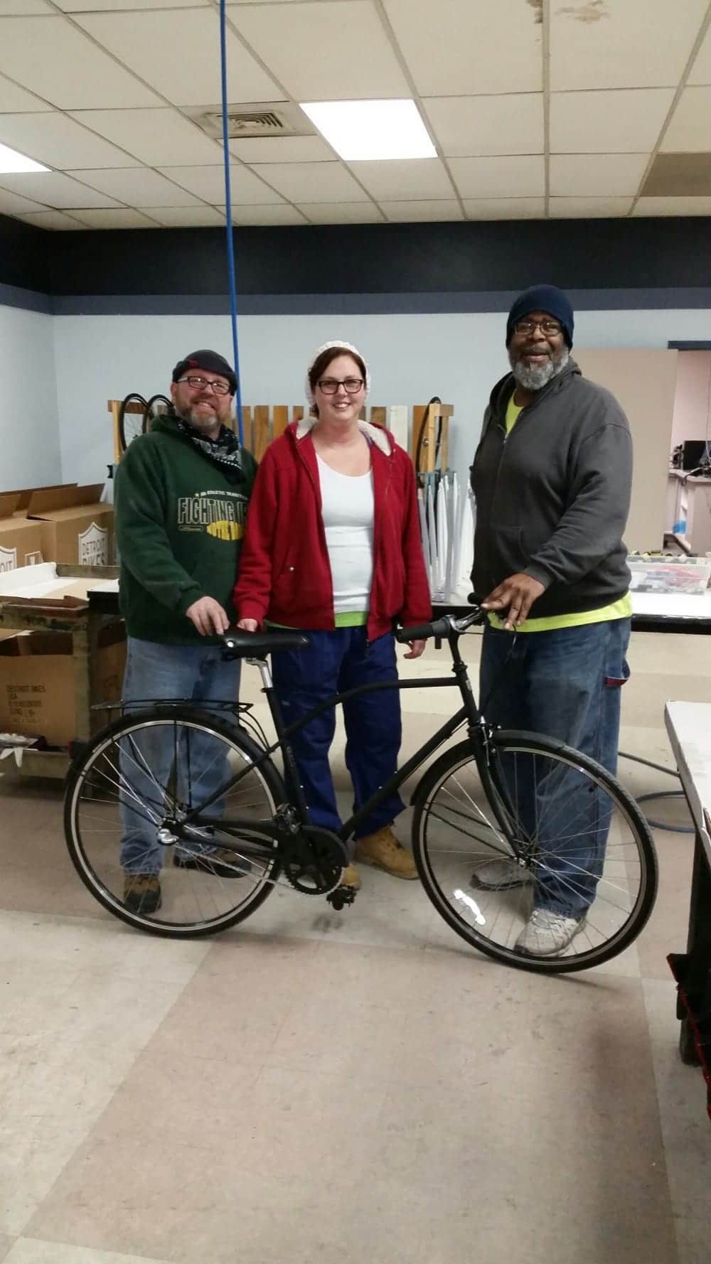 John, Amanda, and Henry proud of their Detroit Bike.