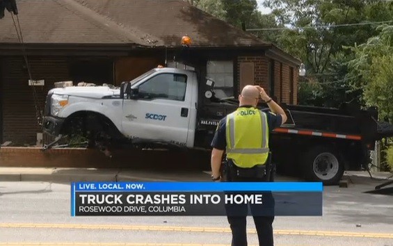 DOT truck crashed into house.