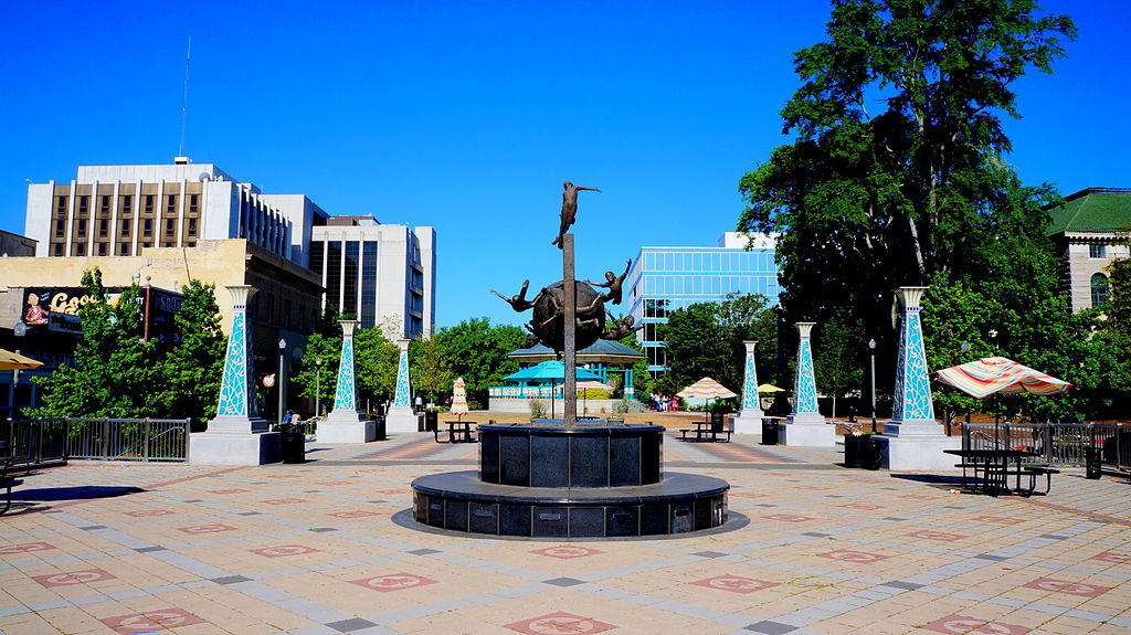 Decatur square against a business buildings and a clear blue sky